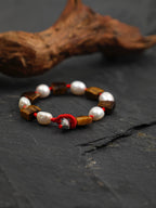 AMBER AXIS · Tiger's Eye & Pearl Bracelet
